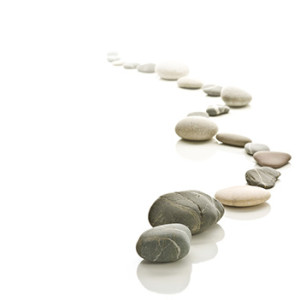 A path of pebbles on a white background